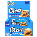 A box of Cheat Great White Crunch protein bars, showing the front and side views of the packaging. The packaging is bright blue with white and navy text, and an image of a protein bar stack topped with peanut butter and dulce de leche.