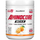 A white plastic tub of Allmax Aminocore BCAA powder in orange flavor, featuring a white label with red and black text and orange graphics.