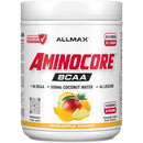 A white plastic tub of Allmax Aminocore BCAA powder in Pineapple Mango flavor, featuring a white label with red and black text and fruit illustrations.