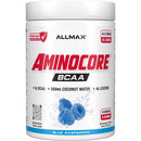 A white plastic tub of Allmax Aminocore BCAA powder in Blue Raspberry flavor, featuring a white label with red and black text and blue raspberry graphics.