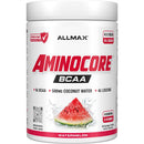A white plastic tub of Allmax Aminocore BCAA powder in Watermelon flavor, featuring a prominent red and black logo and a watermelon slice graphic on the front label.