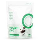 A white stand-up pouch of raw vegan pro chocolate protein powder with green text and graphics, shown on a clean white background.