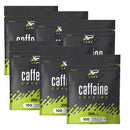 Multiple packages of XP Labs caffeine supplement on a white background