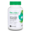 A bottle of Organika Activated Charcoal supplement with 90 capsules, predominantly white and green in color.