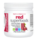 Container of Prairie Naturals RED Superfoods powder, 210g, with images of various fruits and vegetables on the label.