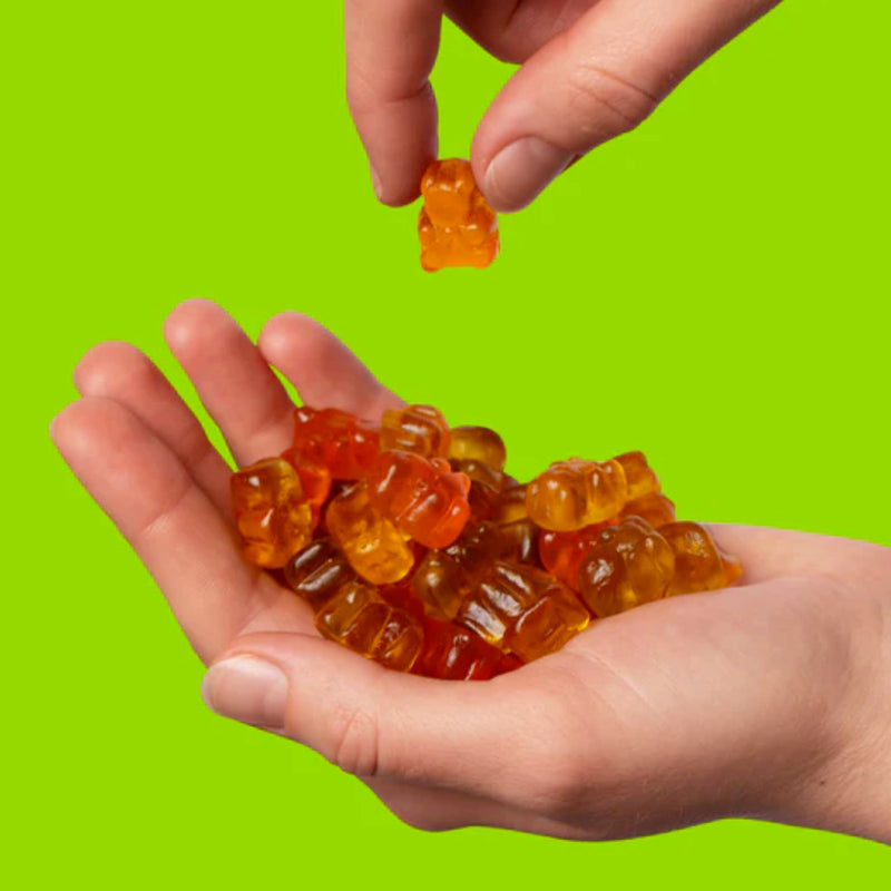 Better Bears (box 12 bags) image of hand holding better bear gummies. With only 3g of sugar and 80 calories per bag, Better Bears’ gummies are the perfect carefree candy to help curb cravings!